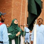 flag hoisted women university